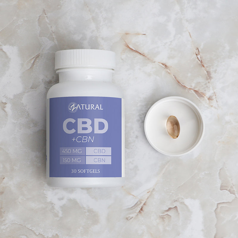 CBD + CBN supplement bottle on a marble surface