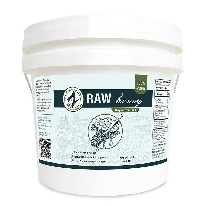 Container of raw honey with a label on a white background