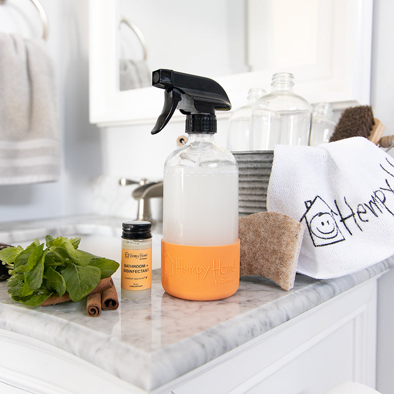 Hempy Home Bathroom and Disinfectant concentrate cleaner and spray bottle in a bathroom