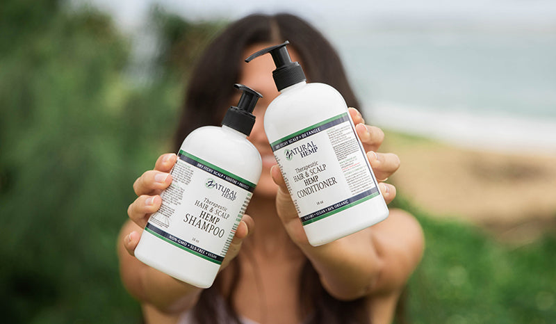 Woman with beautiful long dark hair. hemp seed oil for hair. hemp oil for hair growth.