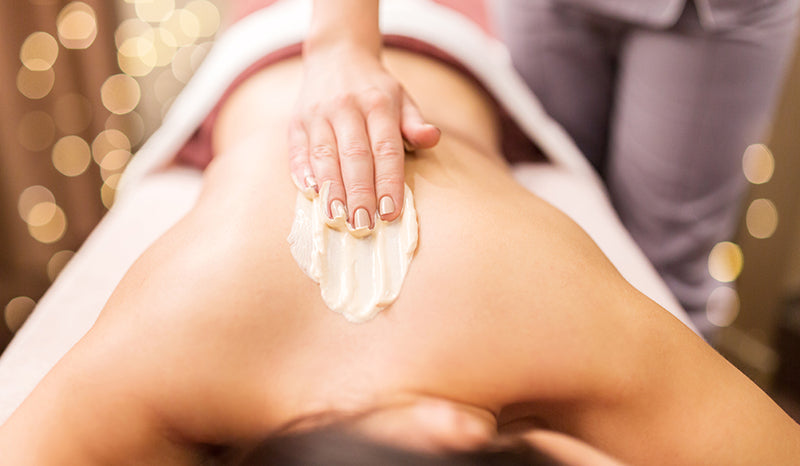 Zatural Hot cream applied to women's back.