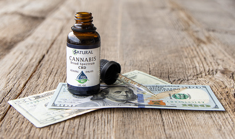 Are you overpaying for CBD? Zatural CBD on a pile of money.
