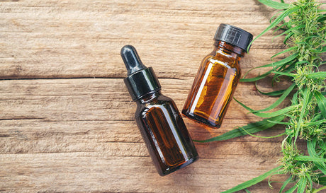 CBD oil products on display. hemp extract vs cbd oil. Does hemp oil extract have cbd? Is cbd oil and hemp extract the same thing?