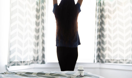 women stretching after waking up from sleep. Does hemp oil help you sleep 