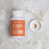 CBD + CBG supplement bottle on a marble surface