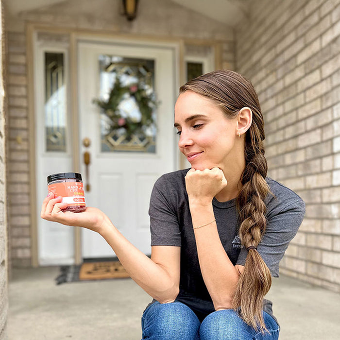 women holding zatural CBG gummies