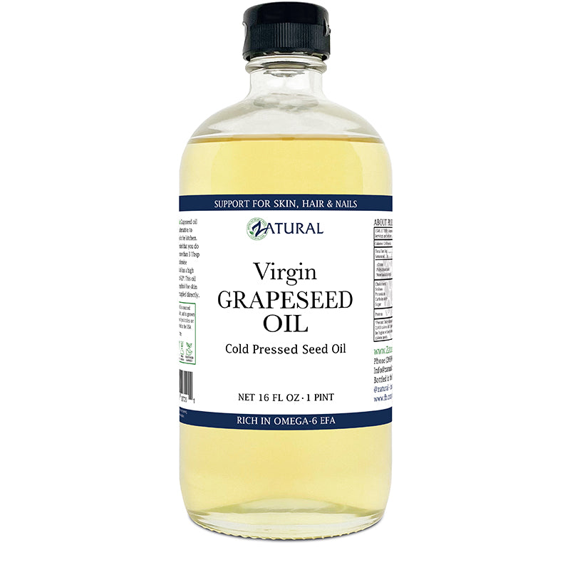 Bottle of virgin grapeseed oil with a label on a white background