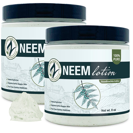 Two jars of Neem lotion with a small amount of lotion on a white background