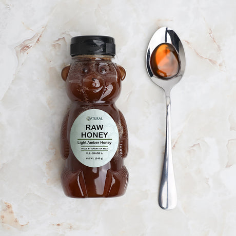 zatural honey on a spoon