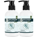 Two bottles of Neem shampoo and conditioner on a white background
