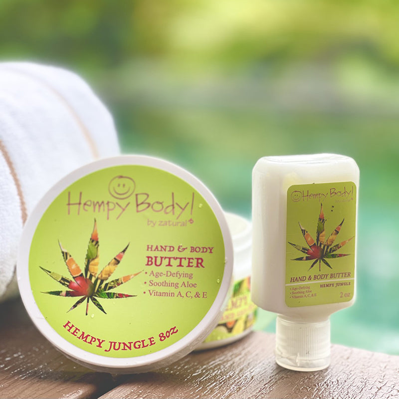 Hempy Jungle Body Butter Jar and 2oz squeeze bottle on outdoor table