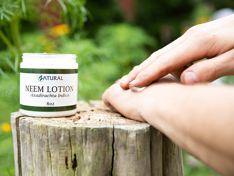 Zatural Neem Lotion being rubbed on hands