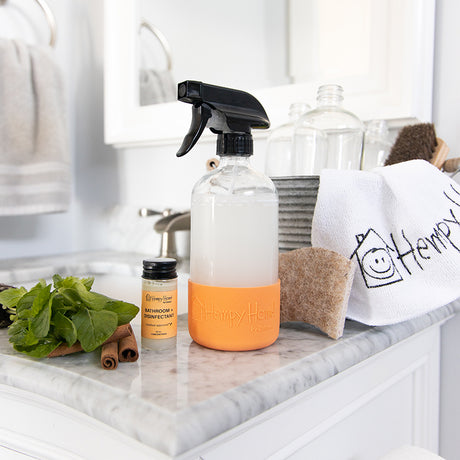 Hempy Home Bathroom and Disinfectant concentrate cleaner and spray bottle in a bathroom