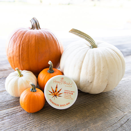 Hempy Pumpkin Spice Body Butter 8oz surrounded by pumpkins